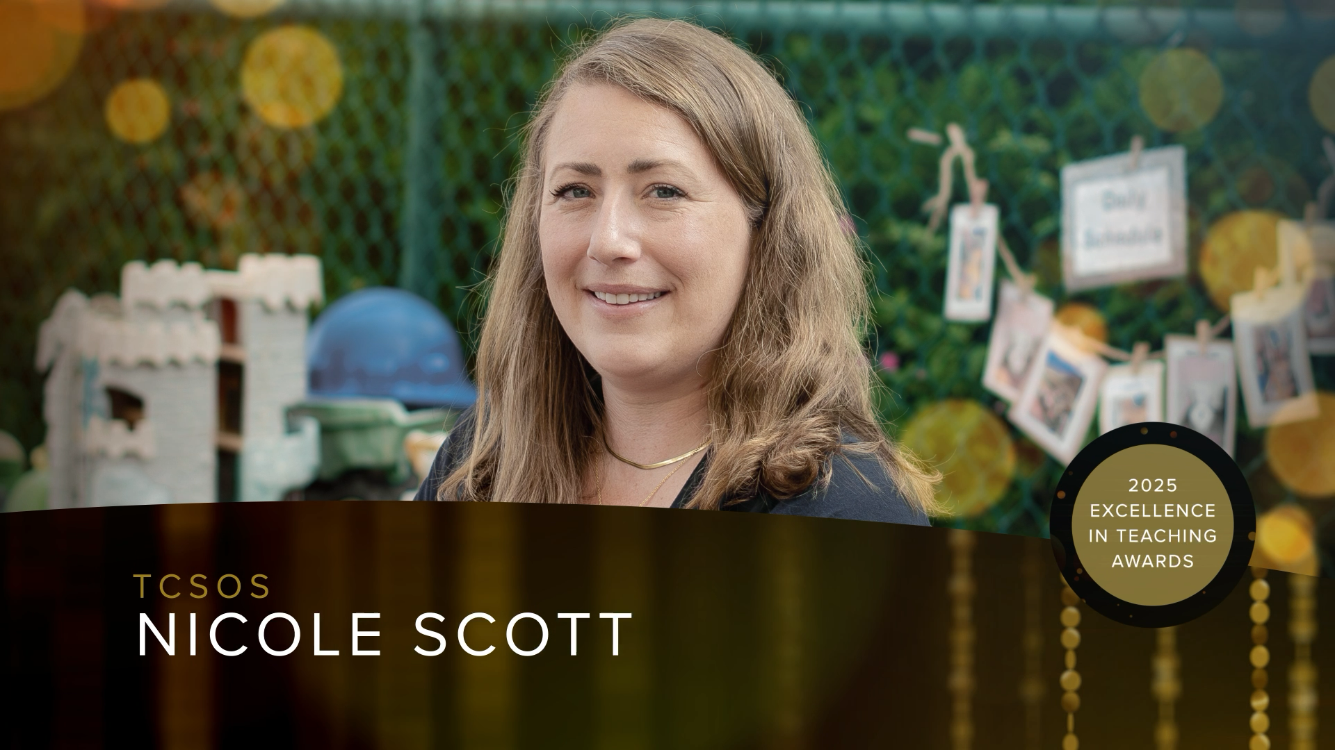 Nicole Scott, recipient of the 2025 TCSOS Excellence in Teaching Award, smiling in an outdoor early learning environment with toys and student work behind her.