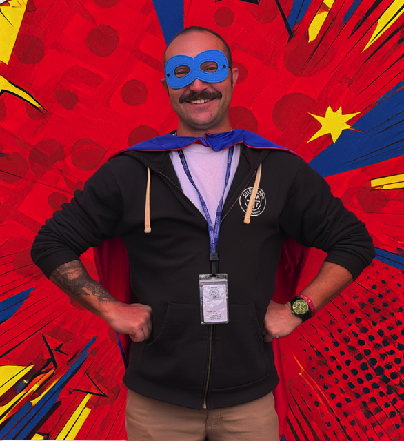 SIL-202511-NC Nathan Calabrese wearing a superhero mask and cape during his Superhero in Learning recognition at the Jamestown RISE site.