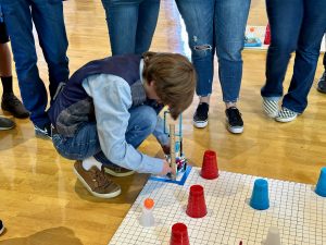 Summerville El: Summerville Elementary student precisely lines up their robot for the start of challenge course.